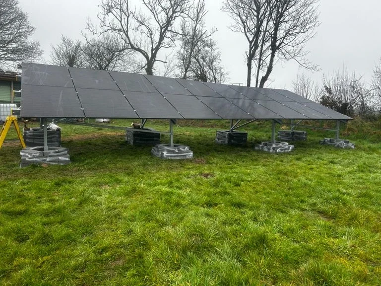 off grid system Solar panel system installed in an open field, capturing sunlight for renewable energy generation.